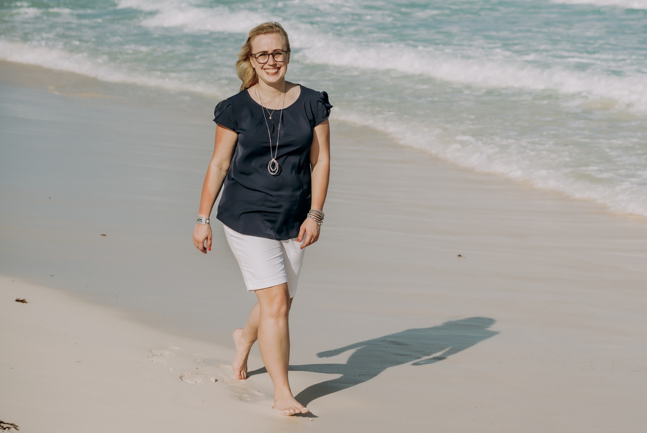Kendra Last walking on the beach